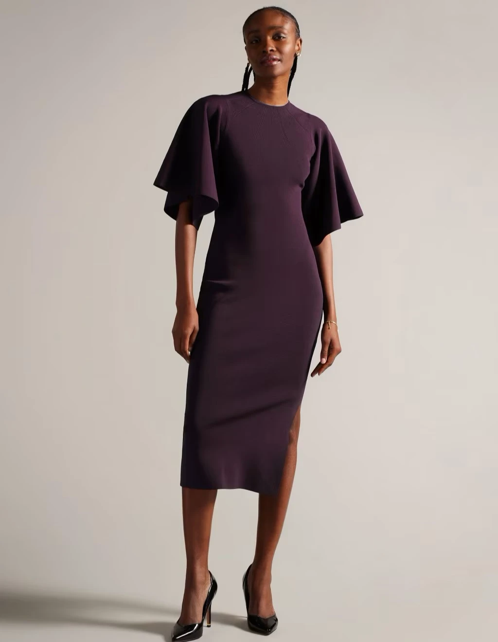 Woman wearing purple Ted Baker dress at M&S