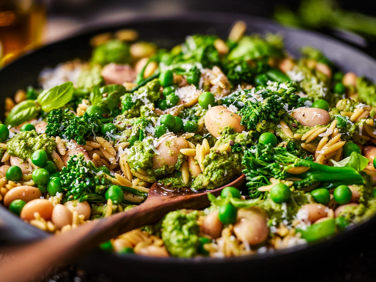 A pan of orzo and beans