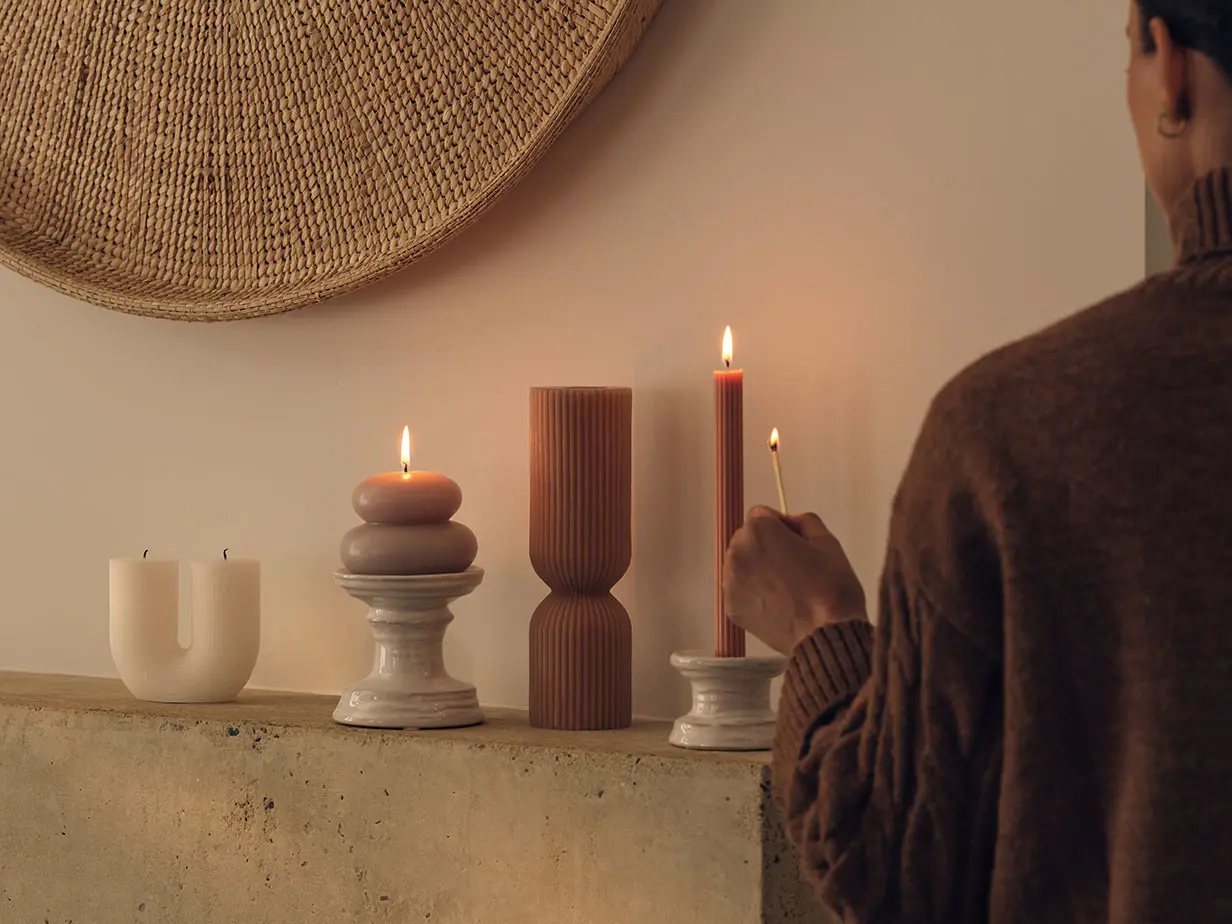 Woman lighting candles