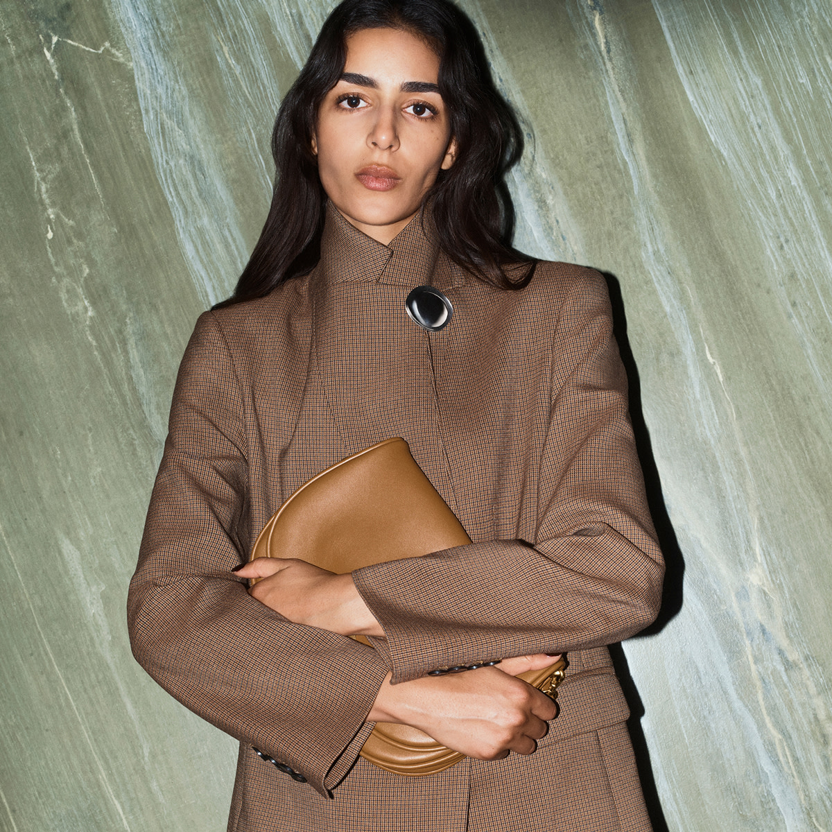 Woman in brown coat