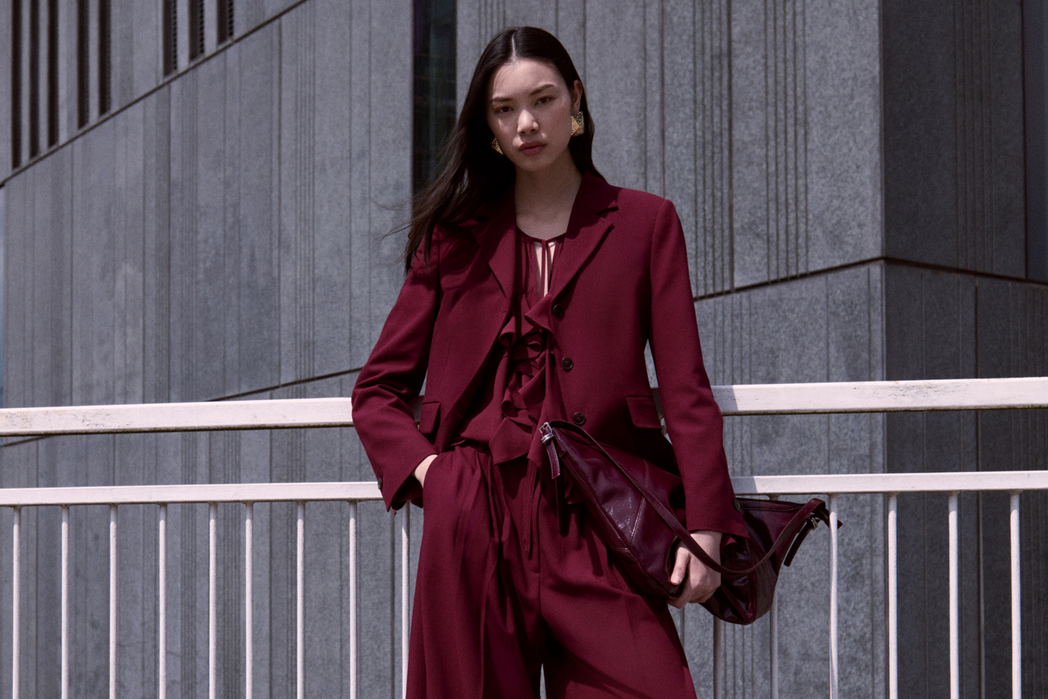 Woman wearing a red suit with a matching red shirt