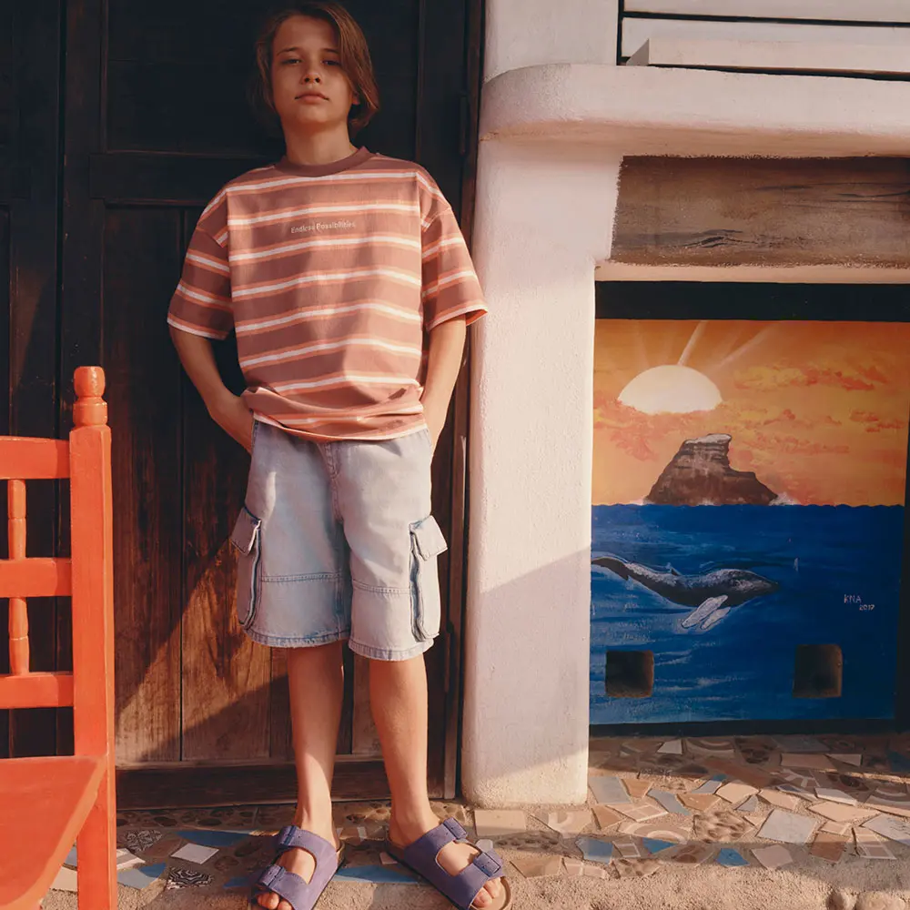 Boy in T-shirt and shorts