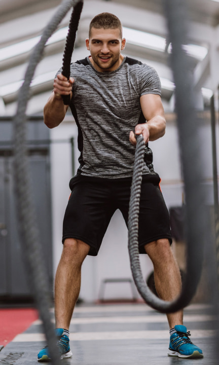 Tactical Conditioning Specialist using battle ropes