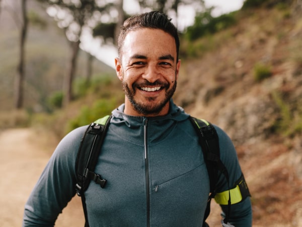 ISSA trainer smiling for a photo while hiking