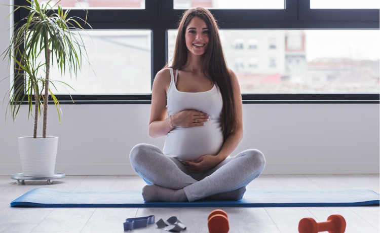 Pregnant woman working out at home