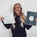 ISSA trainer smiling with her certification
