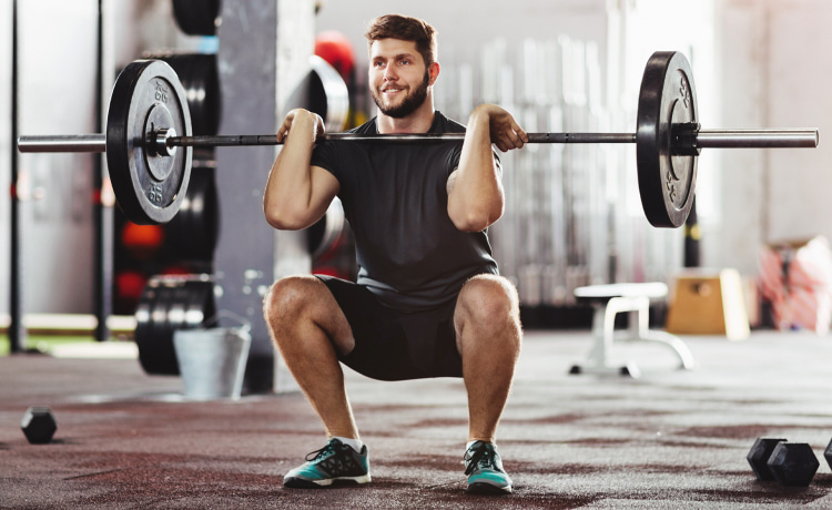 Man Performing a front barbell-squat