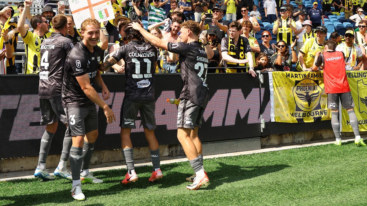 Phoenix players celebrate with fans after tasting victory at Allianz Stadium
