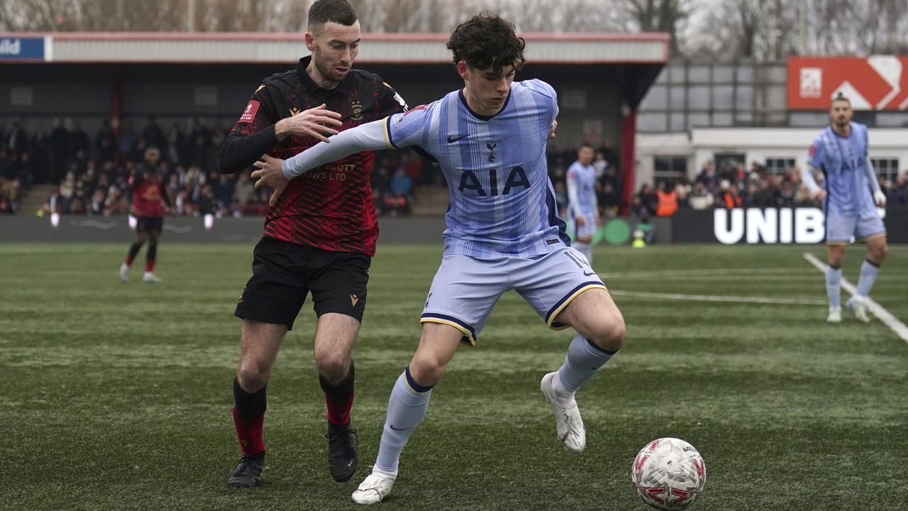 Tamworth's Thomas McLinchey and Spurs' Archie Gray