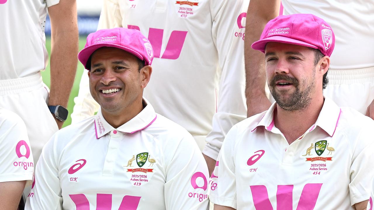 Usman Khawaja and Travis Head posing for a team photo at the SCG