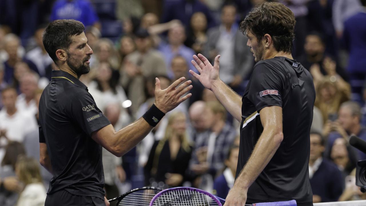 Taylor Fritz congratulates Novak Djokovic
