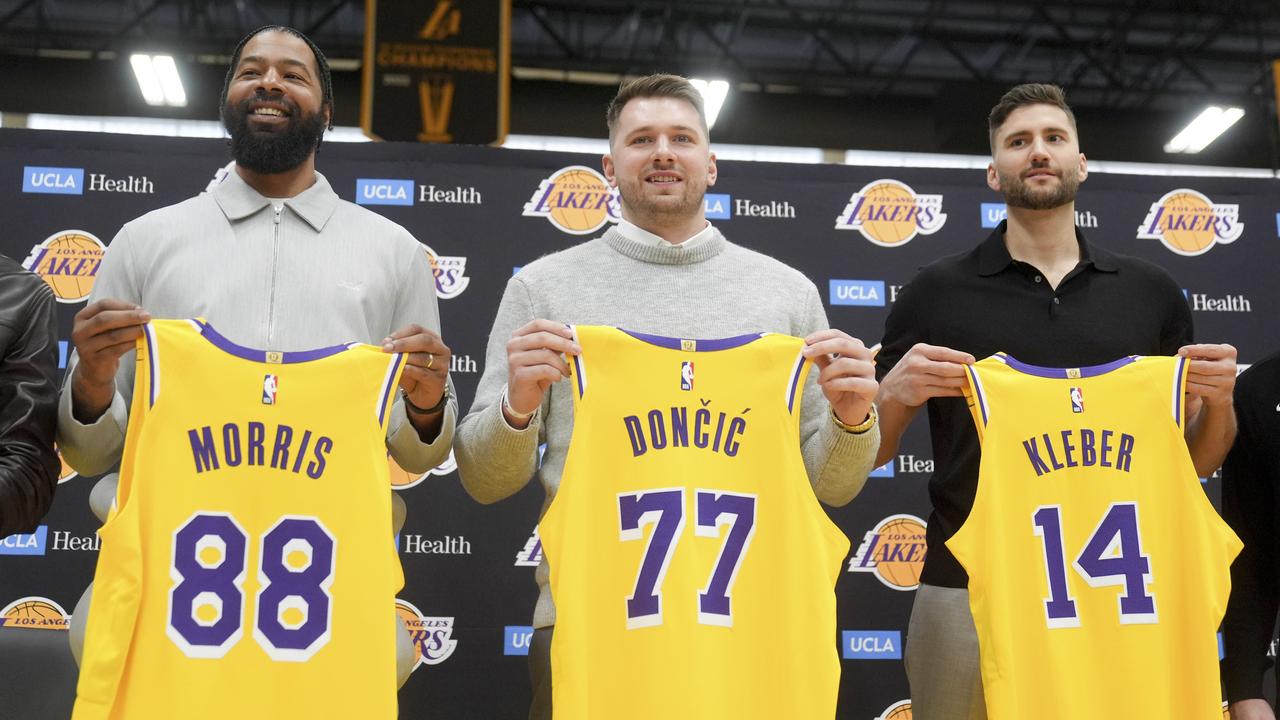 Former Mavs Markieff Morris, Luka Doncic and Maxi Kleber with their new Lakers jerseys. 
