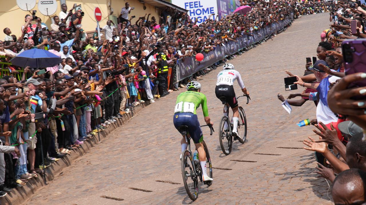 Mexico's Isaac del Toro leads Tadej Pogacar, watched by huge crowds in the Rwanda capital