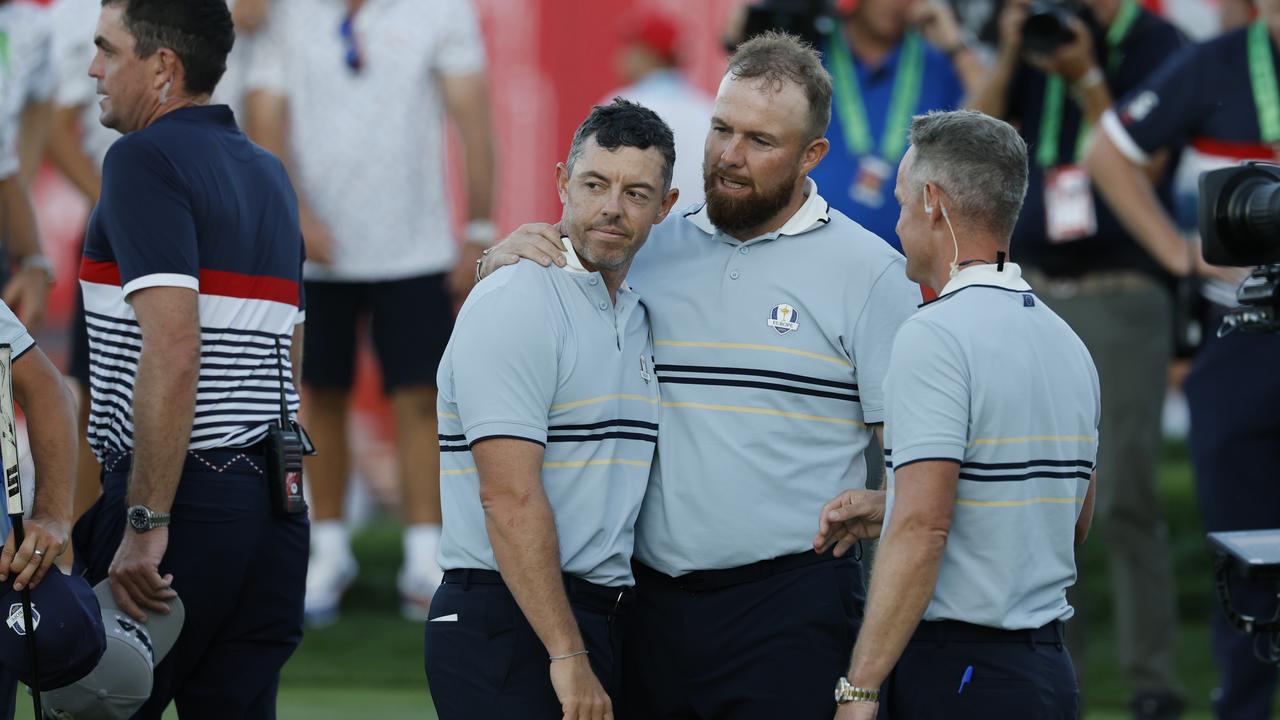 Europe captain Luke Donald with McIlroy and Lowry after their match. Ryder Cup 2025