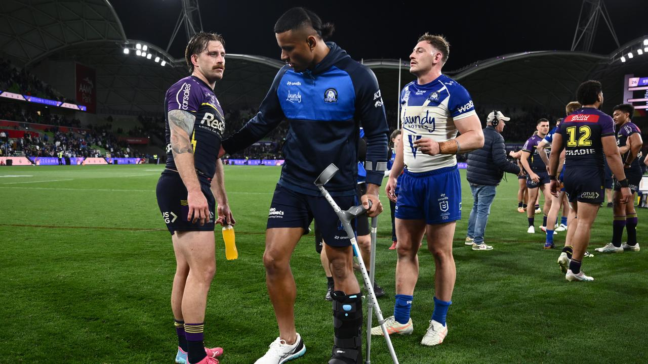 Cameron Munster consoles injured Bulldog Stephen Crichton
