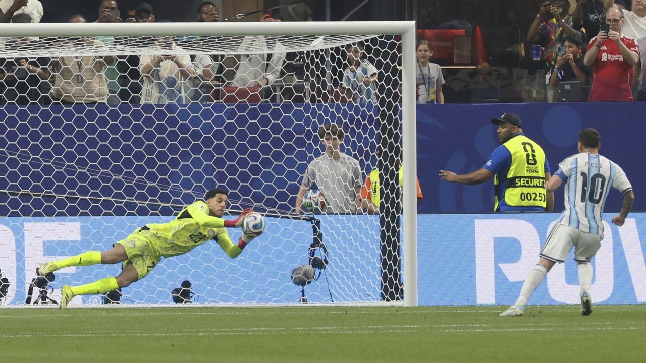 Egypt goalkeeper Mostafa Shoubir saves a penalty kick by Argentina's Lionel Messi
