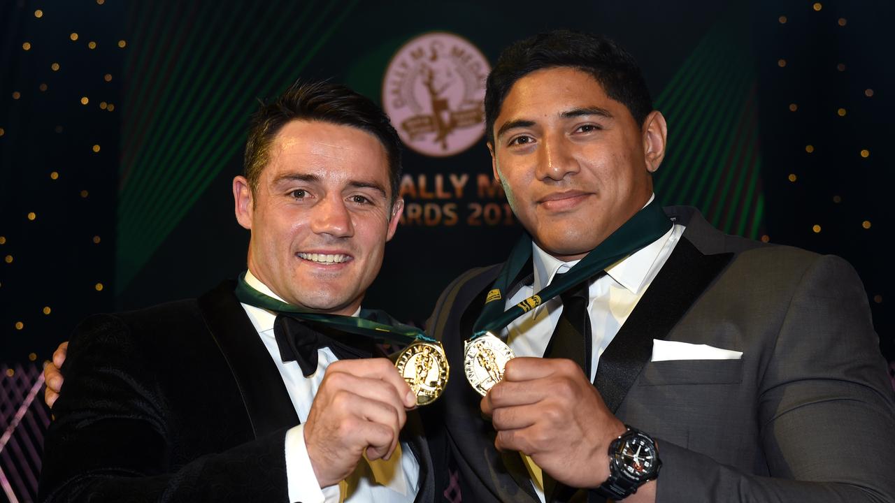 Melbourne Storm's Cooper Cronk and North Queensland's Jason Taumalolo