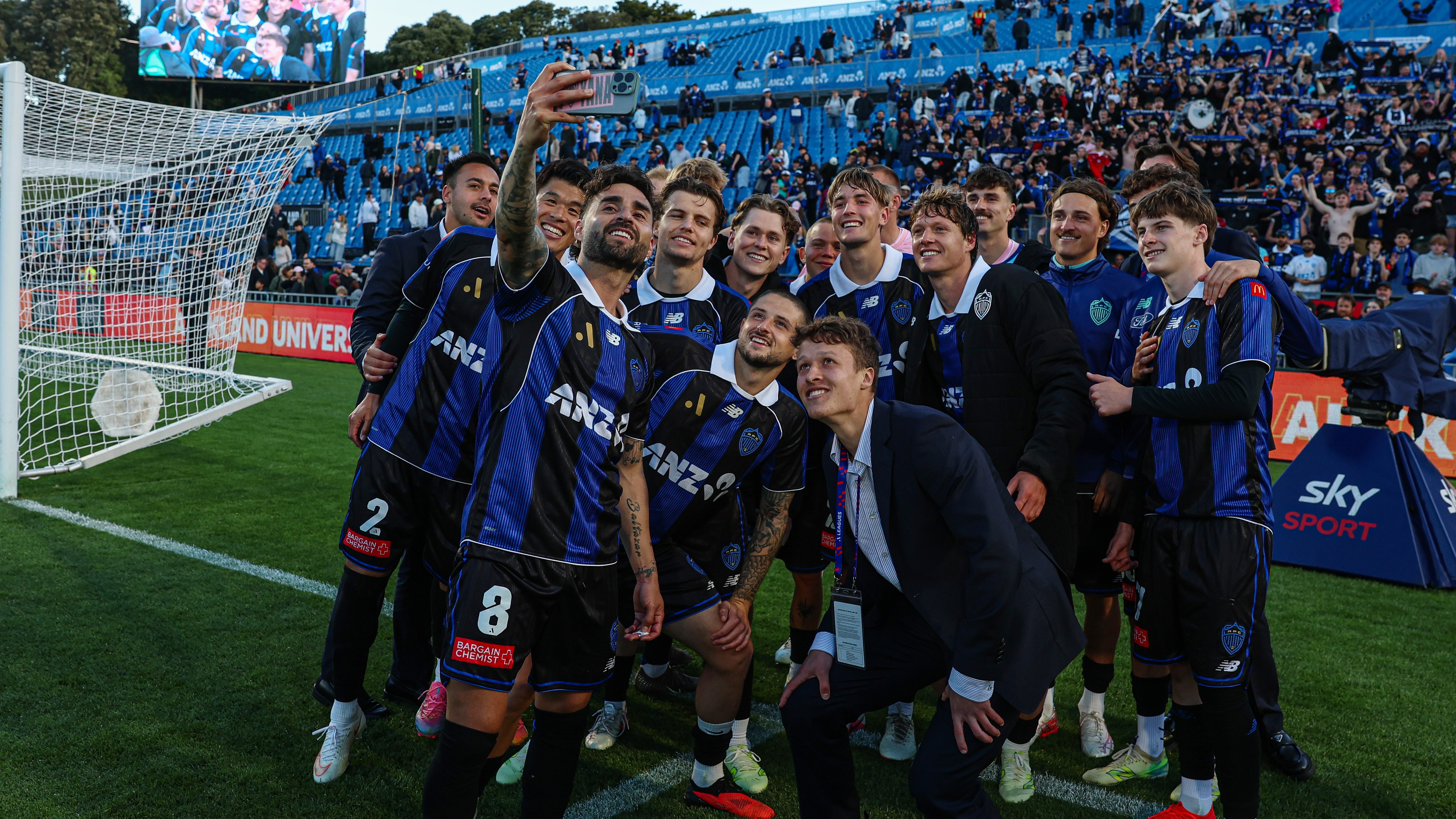 Auckland FC line up for their traditional victory selfie with The Port 