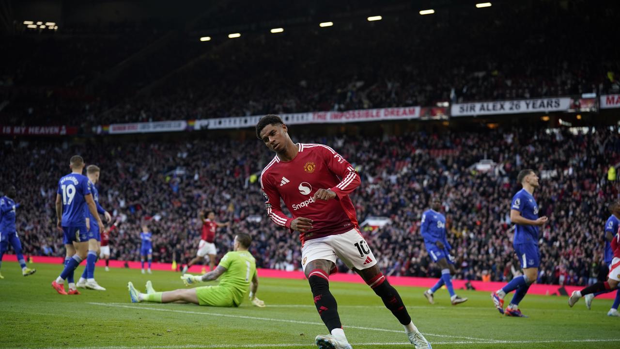 Manchester United's Marcus Rashford wheels away after scoring against Everton