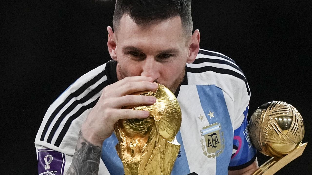 Lionel Messi kisses the World Cup after their 2022 triumph