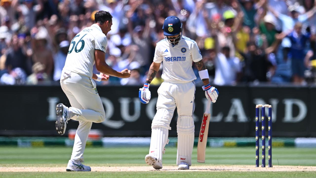 Mitchell Starc celebrates taking Virat Kohli's wicket late in the first session on day five