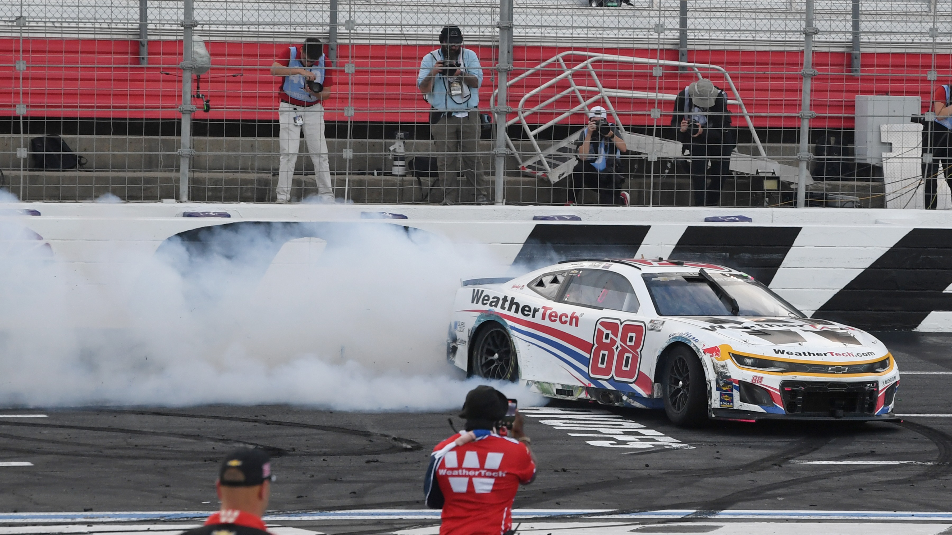 Shane van Gisbergen celebrates winning the ROVAL 400