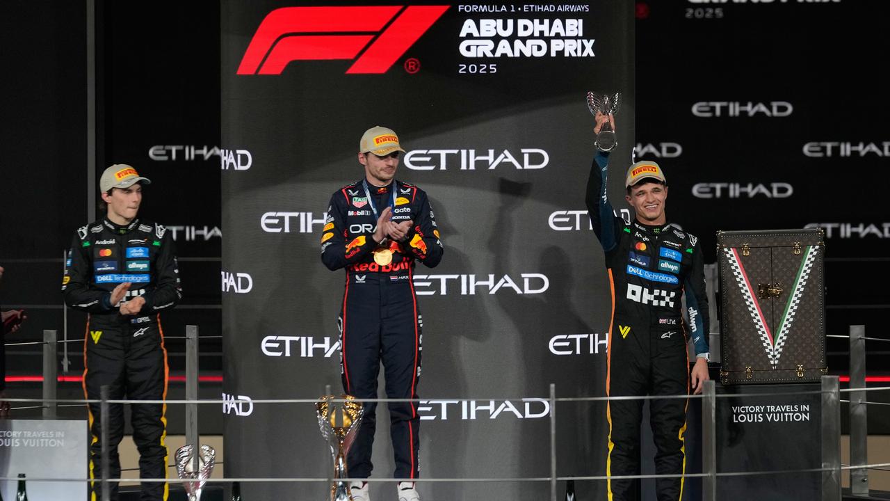 Max Verstappen flanked by Oscar Piastri and Lando Norris