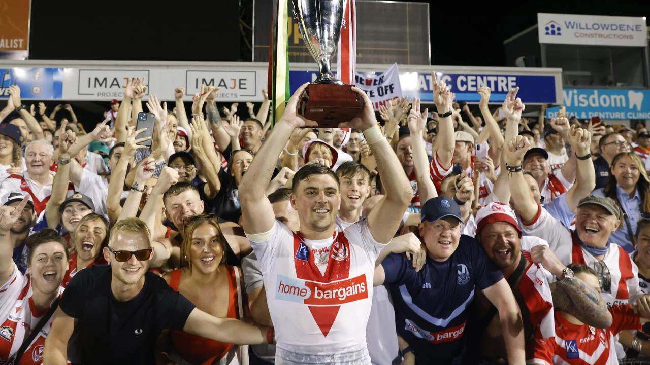 Lewis Dodd raises the World Club Challenge