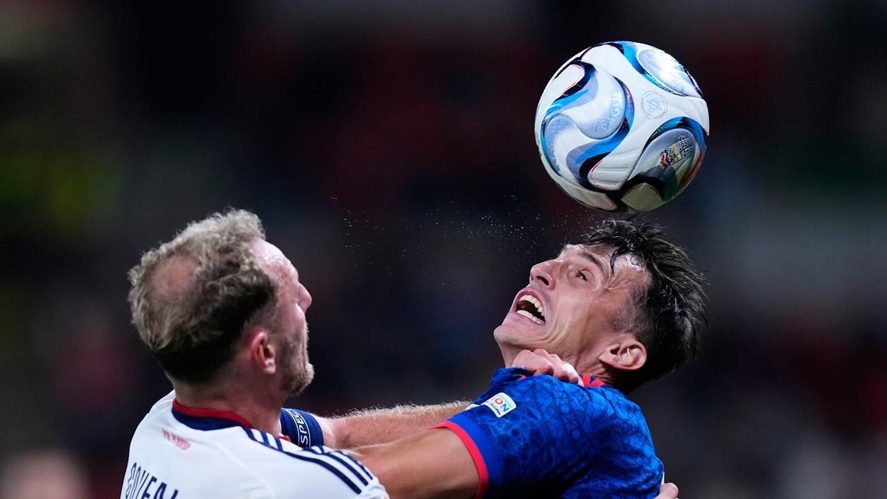 Ante Budimir contests for the ball with Czechia's Vladimir Coufal