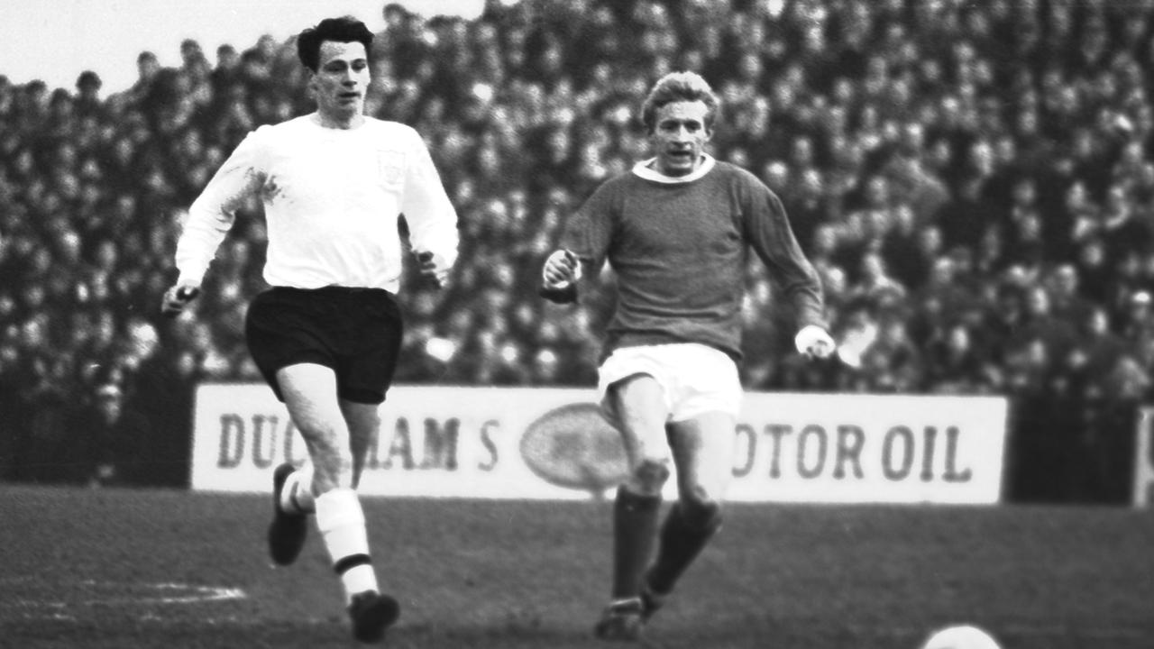 Man United's Denis Law (r) and Fulham's Bobby Robson