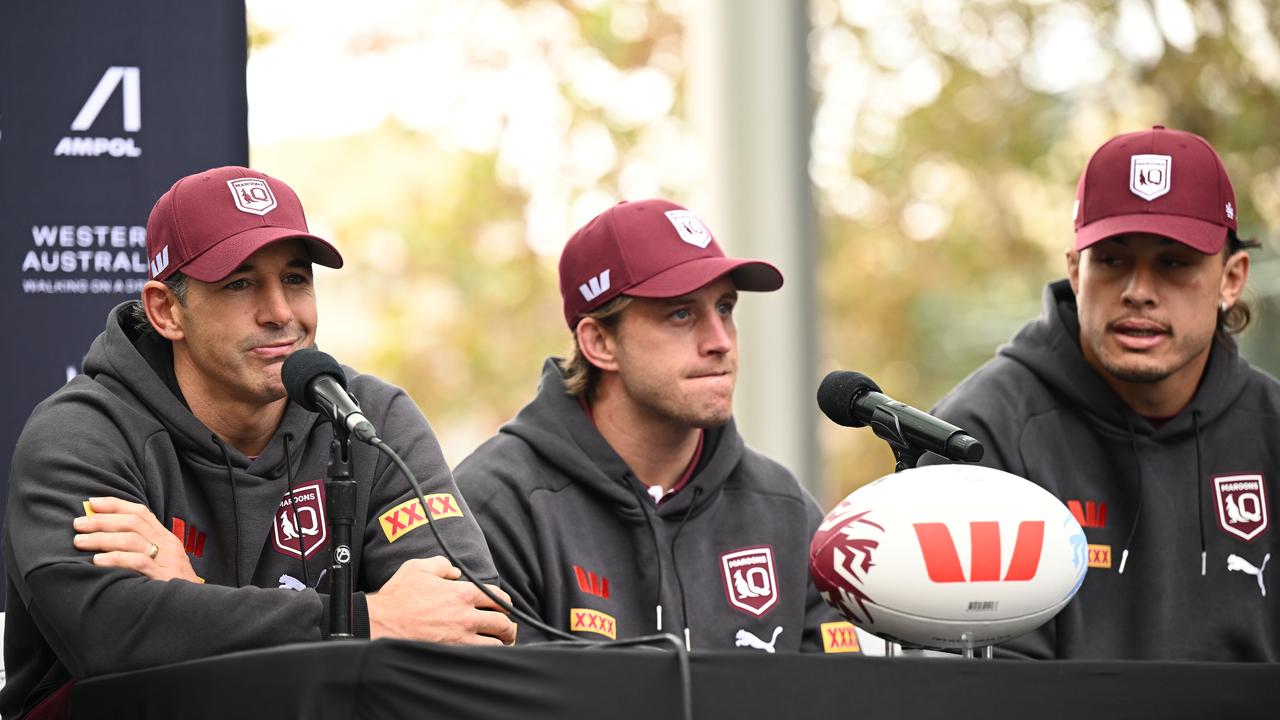 Cameron Munster (centre) and prop Tino Fa'asuamaleaui (right)