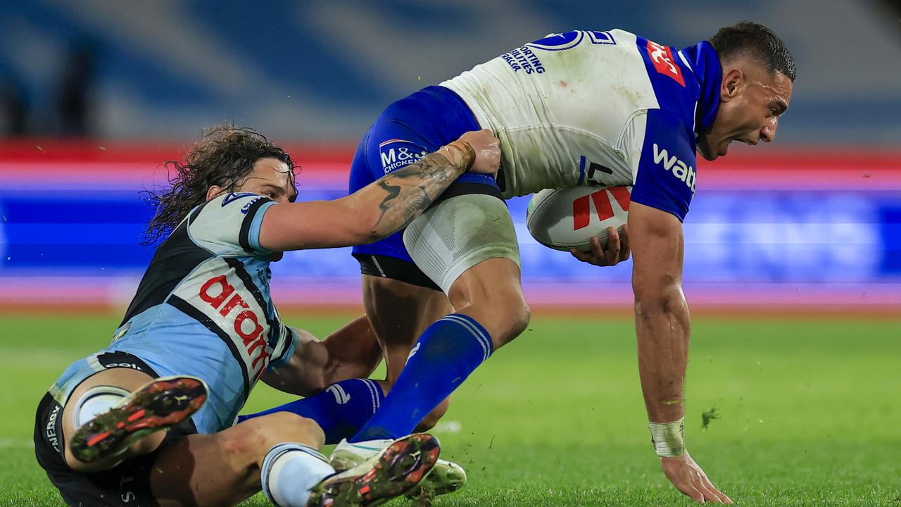 Marcelo Montoya is tackled by Nicho Hynes