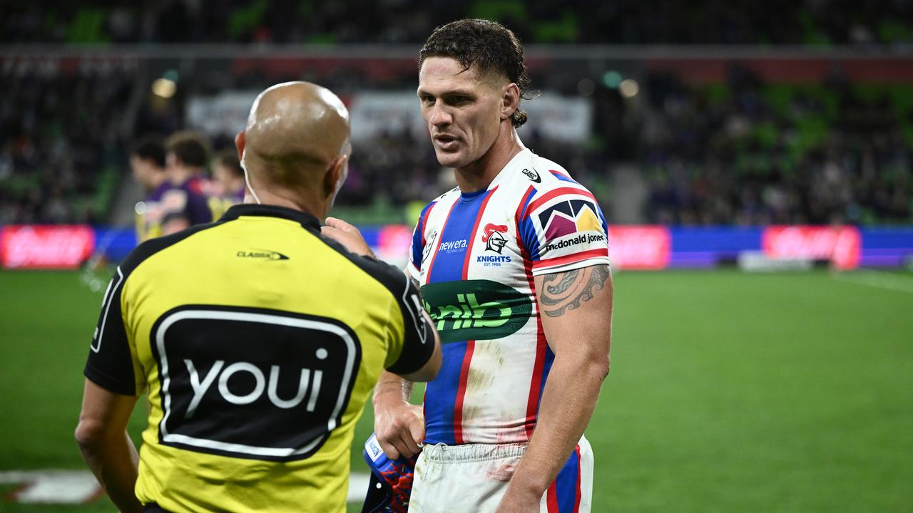 Kalyn Ponga and referee Ashley Klein 