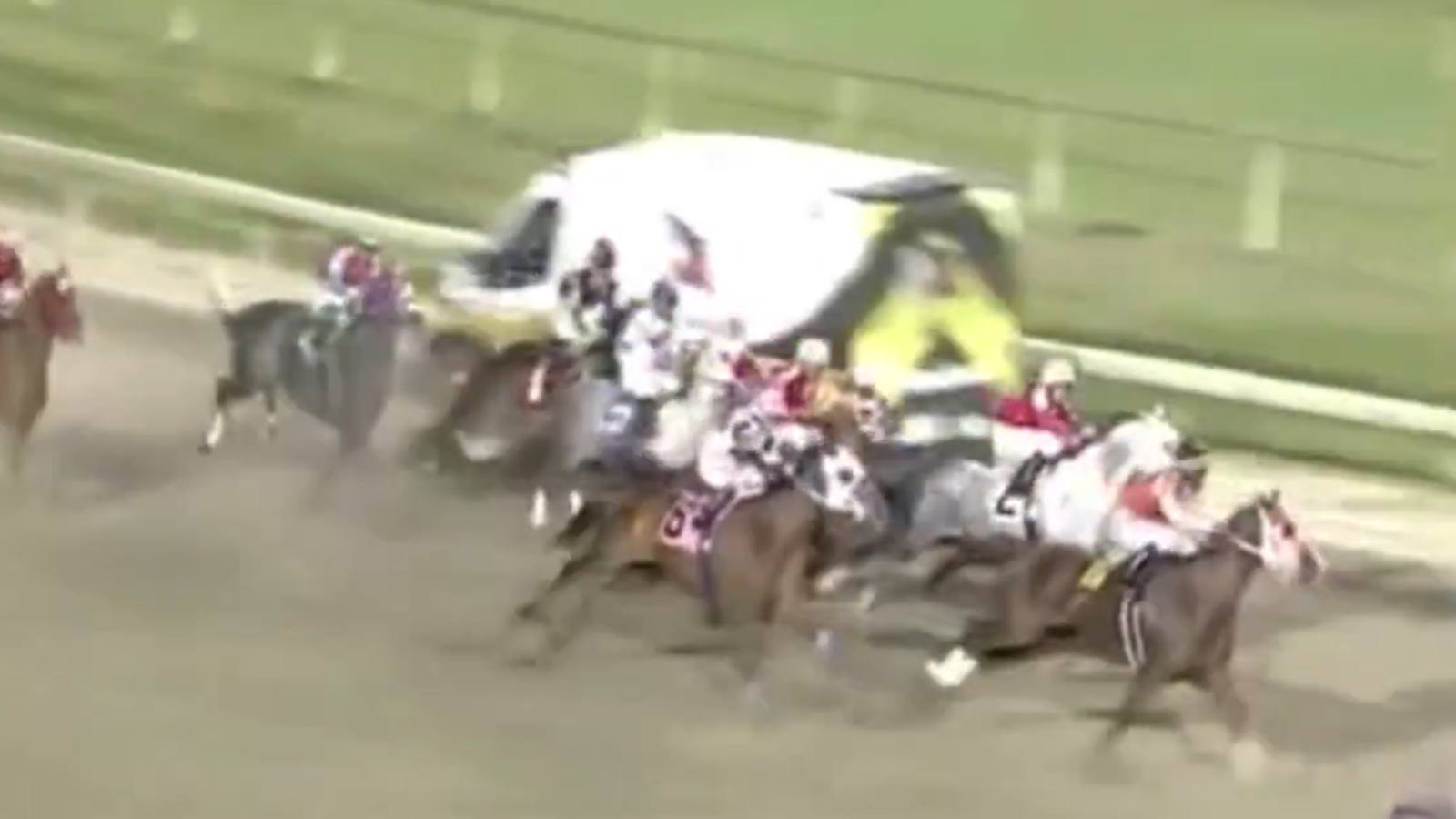 Ambulance on US race track, misses horses and jockeys