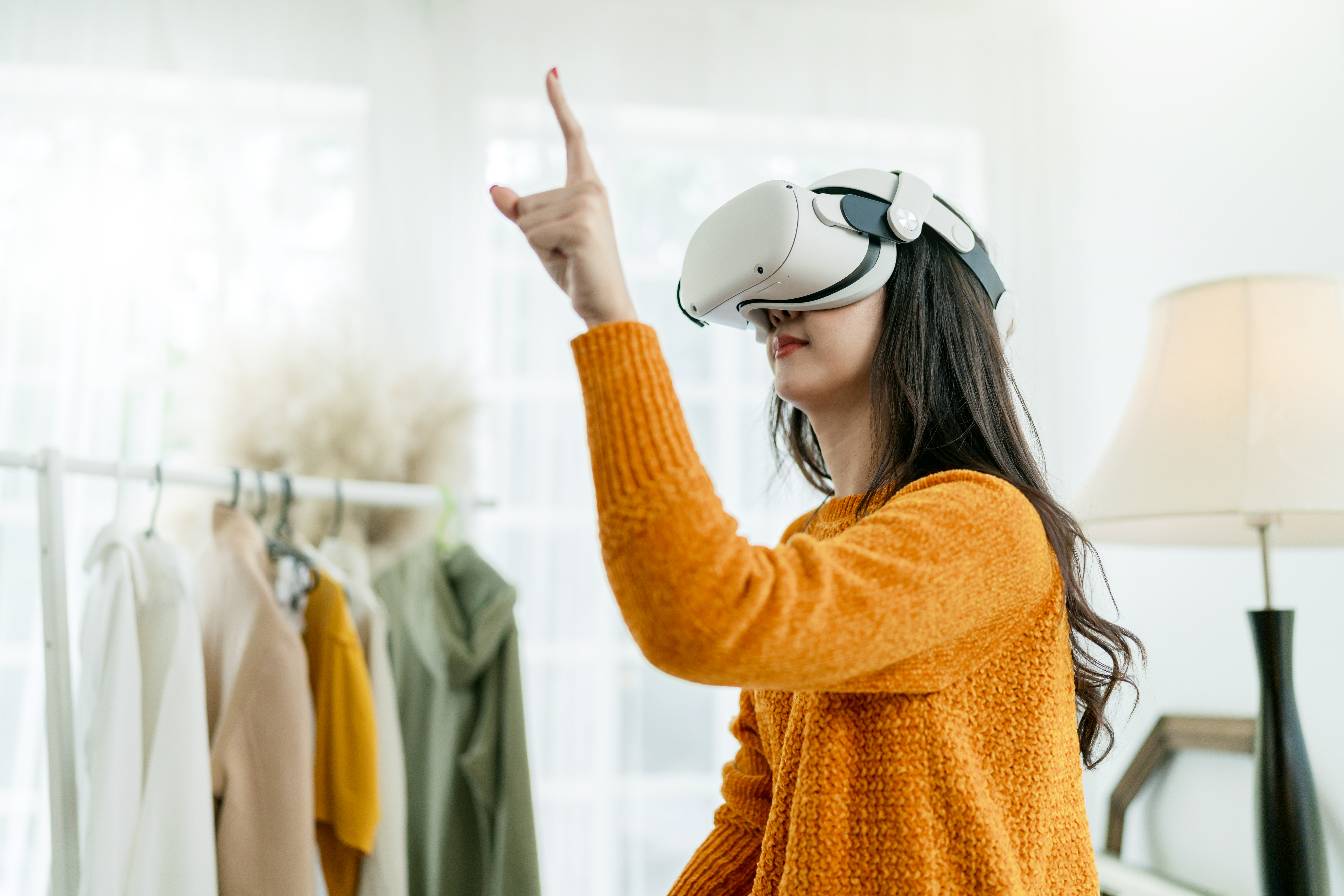 smart-asian-businesswoman-attend-online-virtual-meeting-presentation-new-collections-cloth-fashion-set-to-her-worldwide-client-using-virtual-reality-technology-vr-headset-at-home-studio-daytime