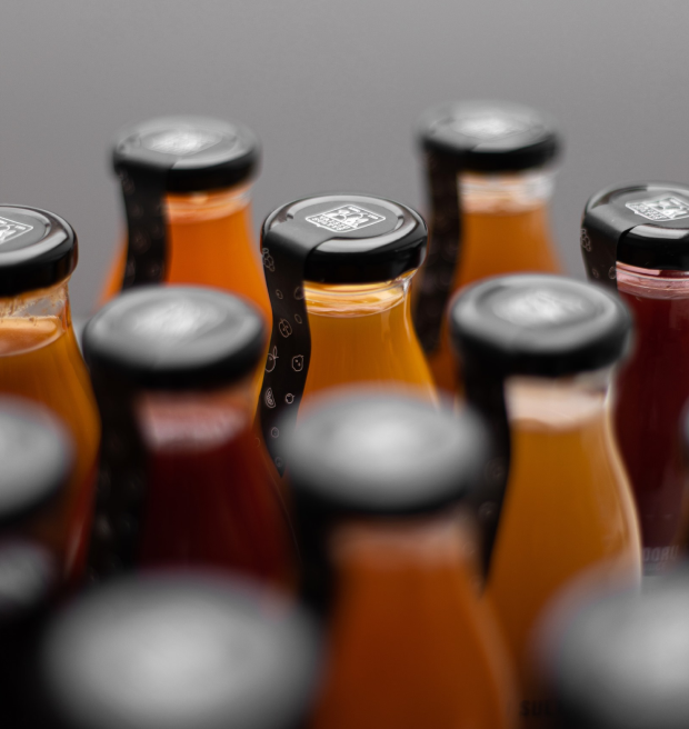 Isometric image of juices and nectars in glass bottles