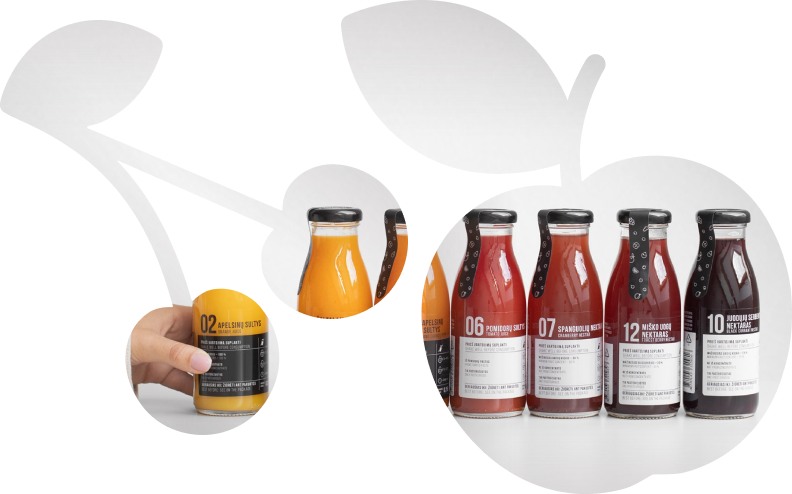 A shape of an apple and a cherry through which an image of glass bottles of colorful juices and nectars are arranged in a line.