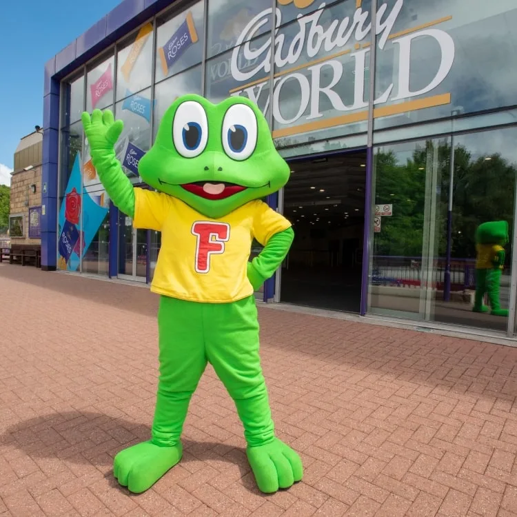 Freddo mascot standing in front of a Cadbury World store