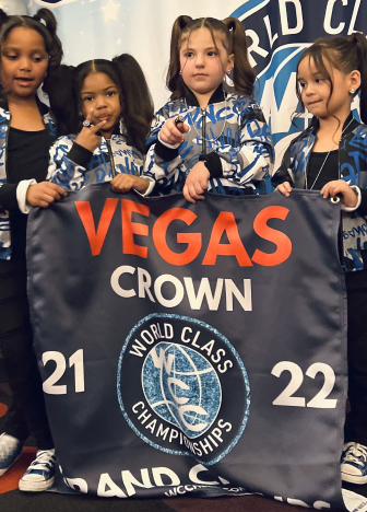 Dance Xpress Girls Holding Banner at Vegas Crown