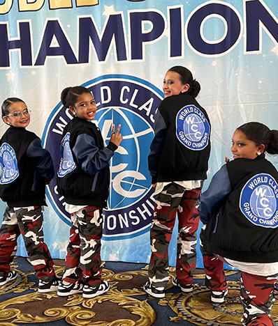 Dance Xpress Girls Holding Banner at Vegas Crown