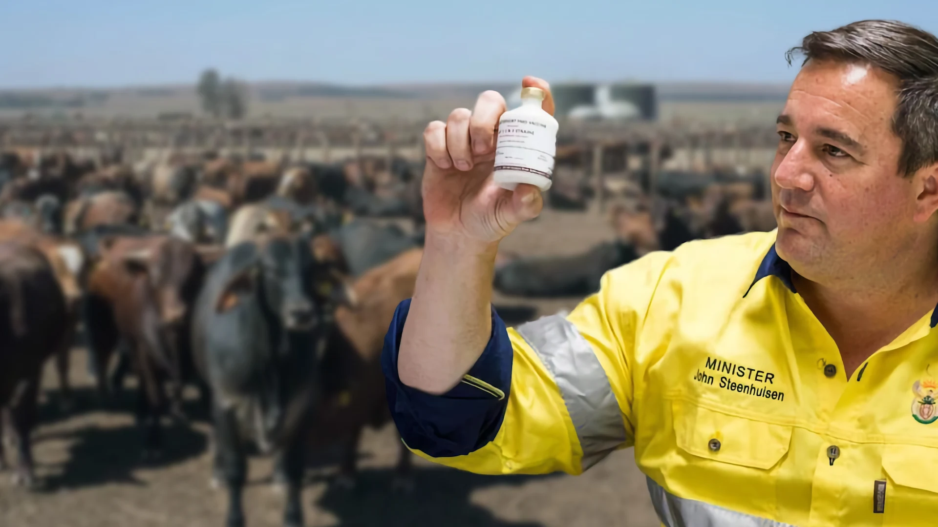 John Steenhuisen showing off vaccine