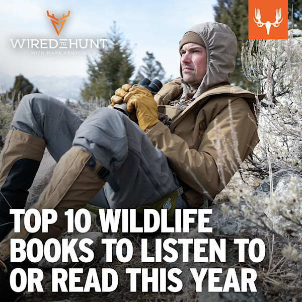TOP 10 WILDLIFE BOOKS TO LISTEN TO OR READ THIS YEAR — man in tan jacket holding binoculars reclining in sagebrush