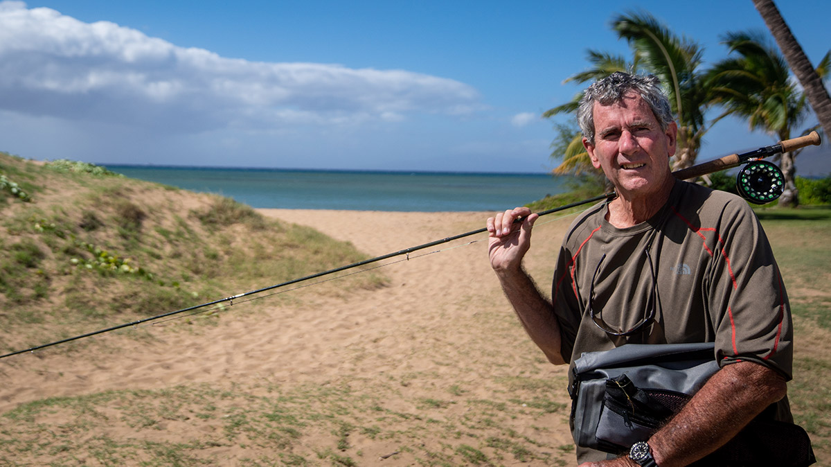 Image of Japanese Man With A Fishing Net Rod Fishing At Seashore