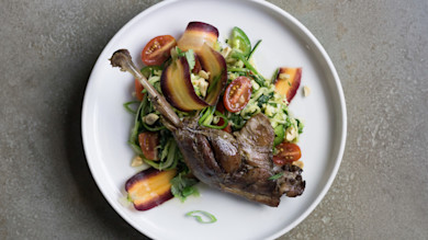 Goose leg confit on Thai salad with zucchini noodles, cherry tomatoes, carrots and peanuts