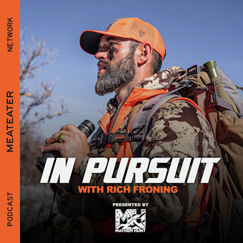 IN PURSUIT WITH RICH FRONING — bearded hunter in orange cap holding binoculars