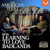 THE AMERICAN WEST - two men seated with microphones against Badlands; text: EP.24 LEARNING TO LOVE BADLANDS