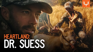 Two hunters kneeling with a large whitetail buck, overlay text "HEARTLAND: DR. SUESS"