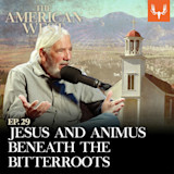 EP.29 JESUS AND ANIMUS BENEATH THE BITTERROOTS; bearded man speaking into microphone with church and mountains