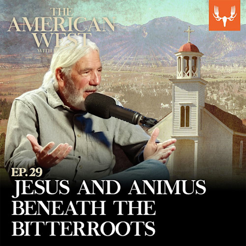 EP.29 JESUS AND ANIMUS BENEATH THE BITTERROOTS; bearded man speaking into microphone with church and mountains