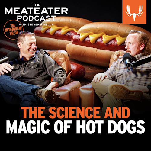 THE SCIENCE AND MAGIC OF HOT DOGS — two men with microphones, oversized hot dogs background